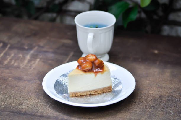 istock caramel macadamia cheesecake or nut cake,macadamia cake or Macadamia Nut cake or caramel cake and butterfly pea tea 2168502715