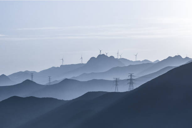 wind power station on hill at sunrise