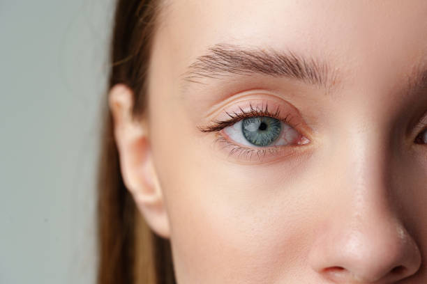 istock Close Up of Woman's Blue Eyes With Natural Makeup 2168507486