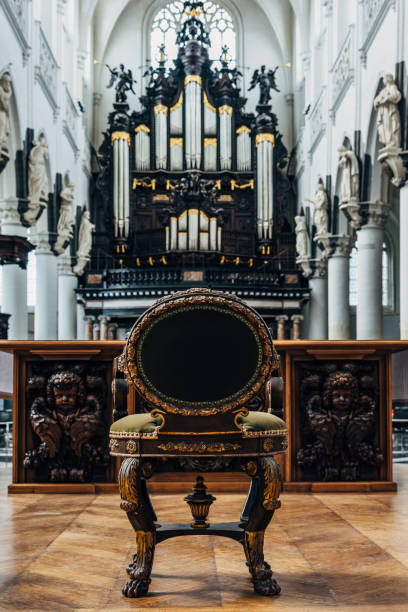 istock Empty chair behind the altar in the cathedral 2168510699