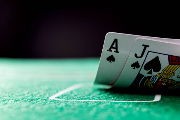 istock Ace and jack card on gambling table 2168512923