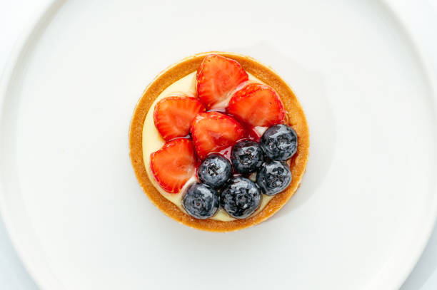 istock dessert in a clear glass with berries, cream and chocolate 2168514480