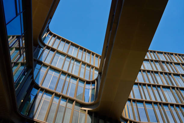 istock Abstract view of modern office building againstr blue sky 2168514558