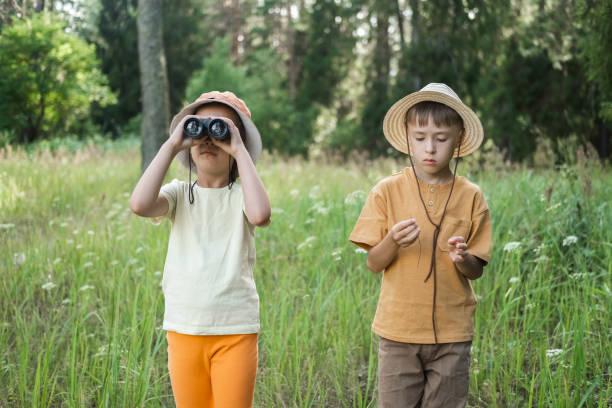 istock Little boy and girl are exploring the forest. 2168514704