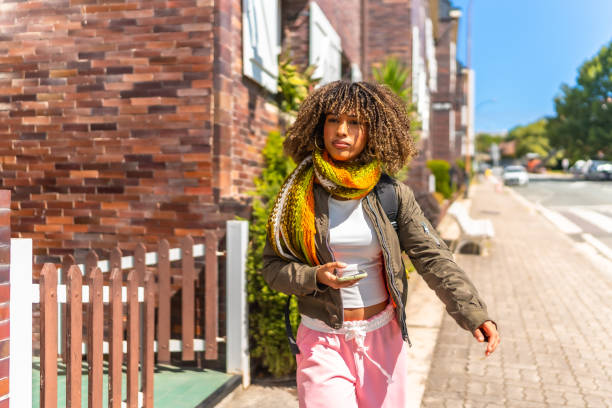 Latin student leaving the house and walking