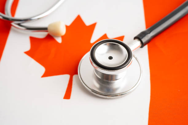 istock Stethoscope on Canada flag background, Business and finance. 2168522085
