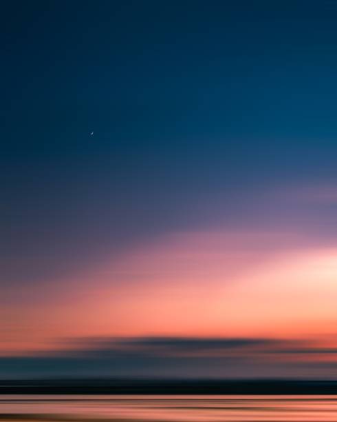scenic view of sea against romantic sky at sunset - crepúsculo fotografías e imágenes de stock