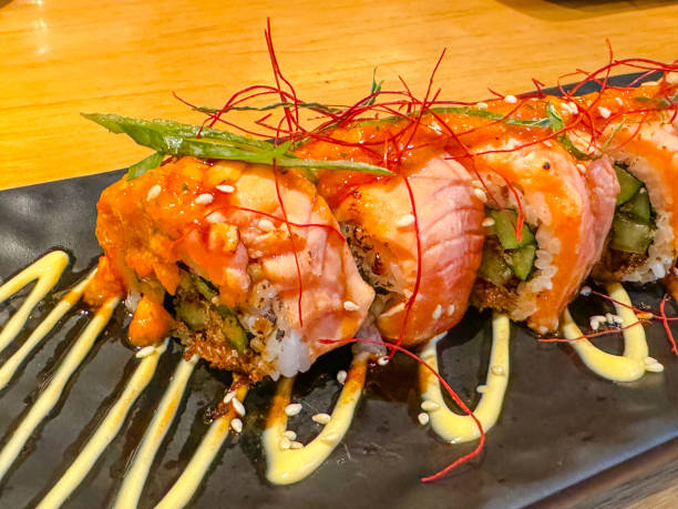 istock salmon sushi in restaurant 2168523453