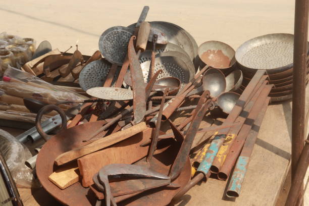 istock Old Rustic iron cooking utensils placed on ground looking like kitchen junk 2168523789