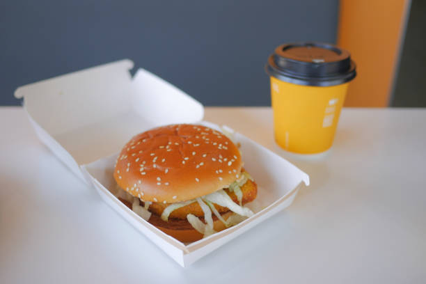 istock Enjoying a Delicious Burger and Coffee Presented Beautifully on a Minimalist Table Setting 2168524997