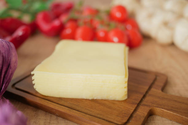 A delicious slice of cheese, perfectly surrounded by a variety of fresh, vibrant vegetables
