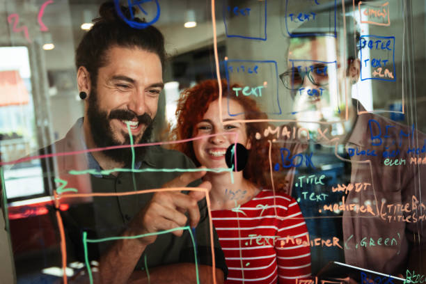 istock Smiling diverse colleagues gather in boardroom brainstorm discuss financial statistics together 2168530372