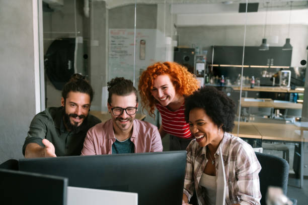 istock Group of business people and software developers working as a team in office 2168531375