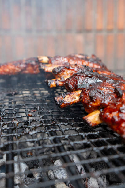 istock Barbecued pork ribs on the grill, close-up. 2168531688