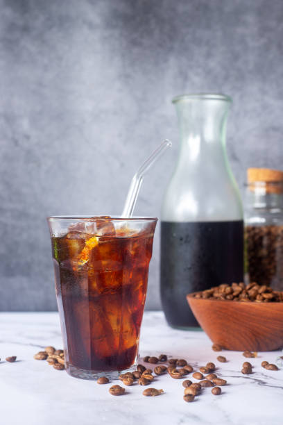istock iced homemade cold brew coffee  with glass straw on white marble  table. 2168532552