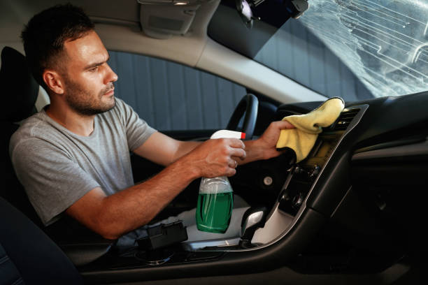 istock Fresh spray. Man is cleaning interior of his car 2168536234