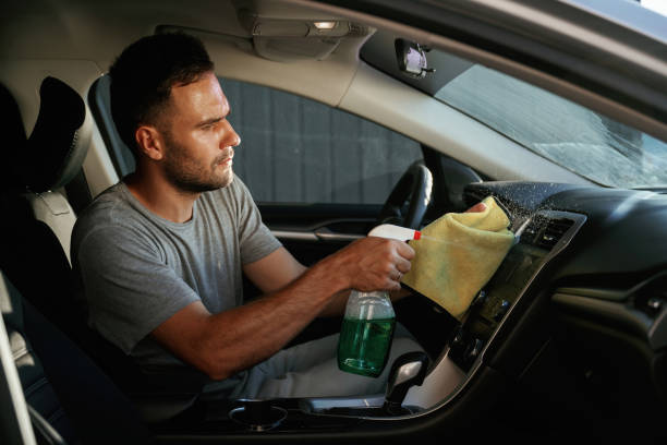 istock Fresh spray. Man is cleaning interior of his car 2168536241