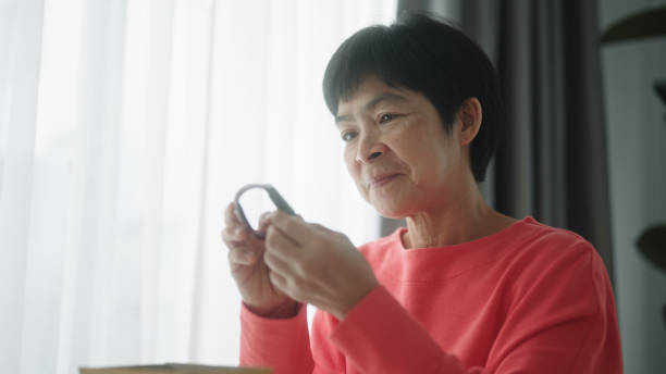 istock Mature woman customer opening delivery package. 2168540096