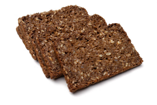 istock Several Slices of Whole Grain Black Bread, Isolated on White Background, Studio Shot 2168541453