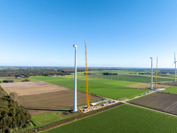 istock Wind turbine construction with huge cranes at a new wind park 2168541662
