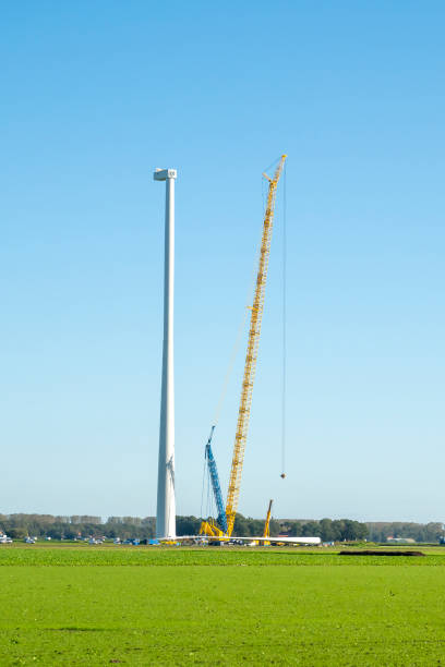 istock Wind turbine construction with huge cranes at a new wind park 2168541996