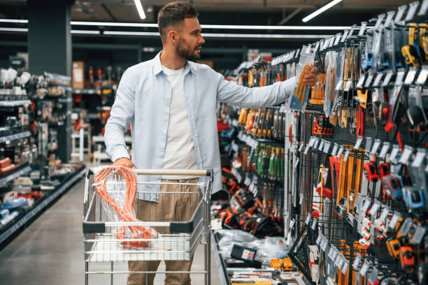 istock Looking for the nice hardware. Man is in the hardware shop 2168543629