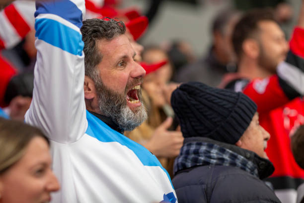 istock Passionate Sports Fan Cheering 2168544198