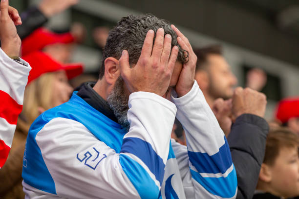 istock Disappointed Sports Fan with Hands on Head 2168545174