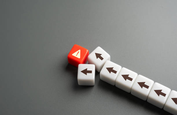 istock Stumble into danger. You can't move on without figuring out the problem. The concept of coming to disaster. Urging attention to a potential catastrophe. Need for proactive measures to avert disaster. 2168545675