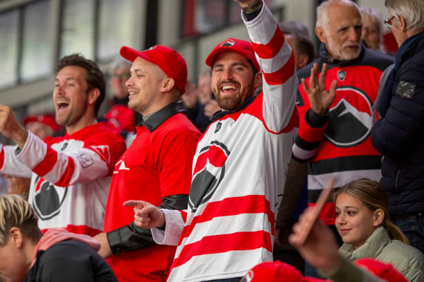istock Joyful Hockey Fans Cheering on Their Team 2168545913