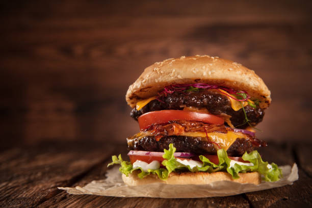 istock Delicious hamburger on wood 2168546490