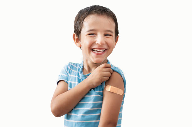 istock happy kid with plaster after vaccine 2168547424