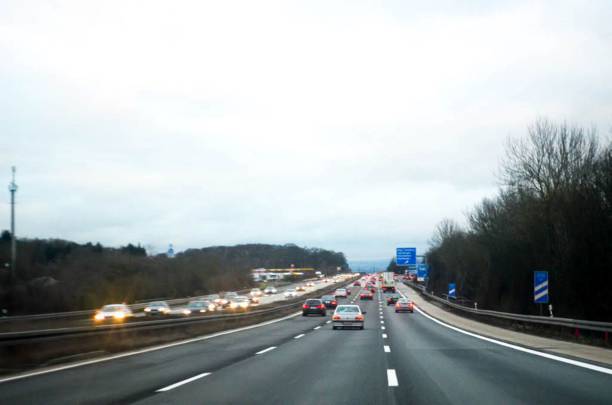 istock Traffic on highway in the cloudy day 2168549384