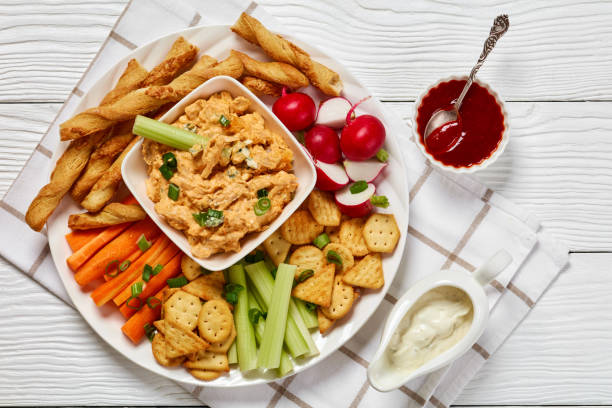 buffalo chicken dip with veggie and bread sticks