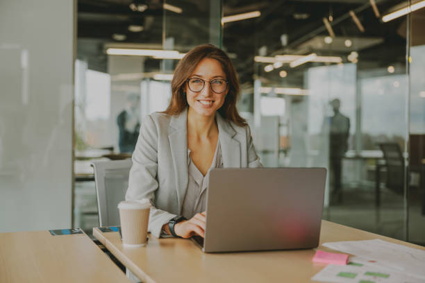 istock A businesswoman is working efficiently on her laptop in a modern, inspiring office 2168551401