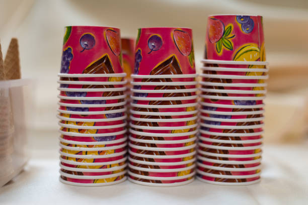 Upside down stacks of colorful, small, disposable ice cream cups.