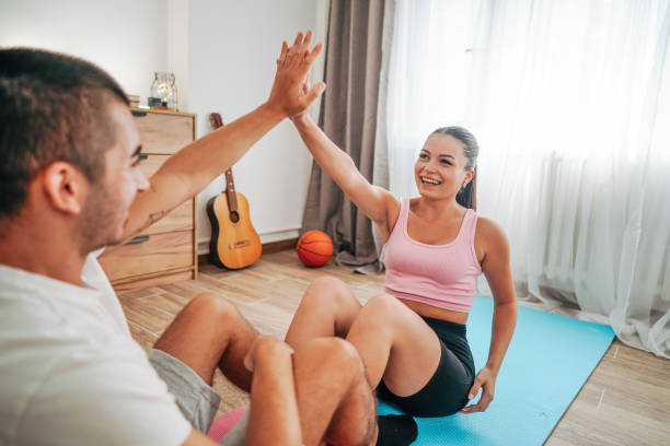 istock couple training pilates at home 2168560865