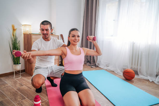 istock couple training pilates at home 2168561449