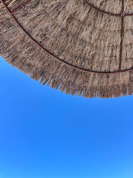 istock Blue sky with sun umbrella Algarve 2168562509
