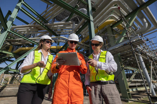 istock Group of petroleum engineers having a discussion at the site 2168562902