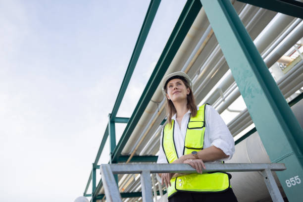 istock Female petroleum engineer working at oil refinery site 2168562929