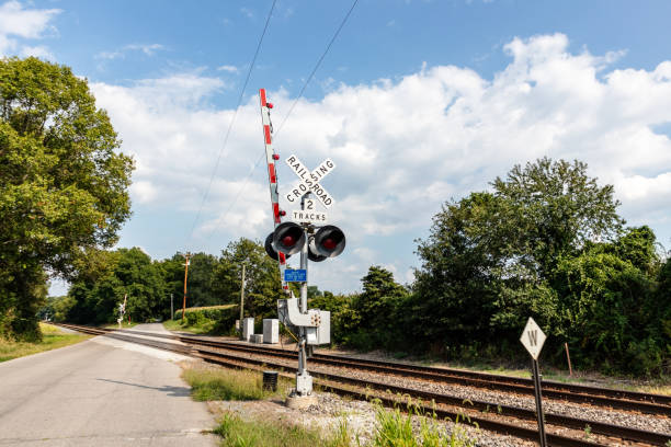 railroad crossing sign by tracks in rural Indiana USA. Indiana, USA August 24, 2024
