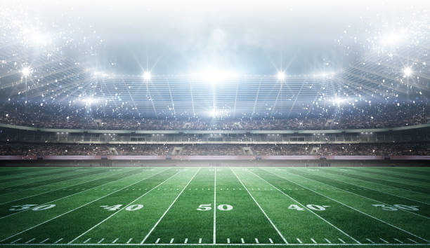 istock IlIuminated American Football Stadium at night with empty field. 2168568606