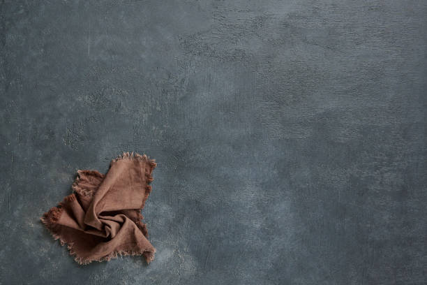 istock Napkin on the old table, up shooting, plate and kitchen tools style. 2168570422