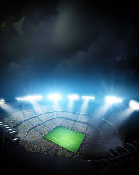 istock IIIuminated American Football Stadium at night with empty field. 2168570506