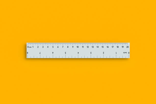 istock Ruler with inches and centimeters on orange background. School equipment. Measuring tool. Top view. 3d render 2168574839