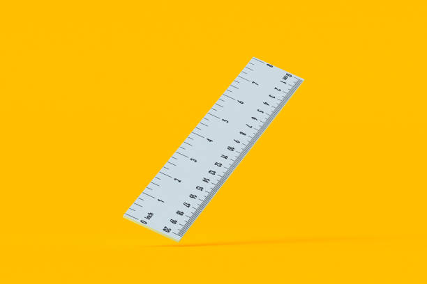 istock Falling ruler with inches and centimeters on orange background. School equipment. Measuring tool. 3d render 2168574842