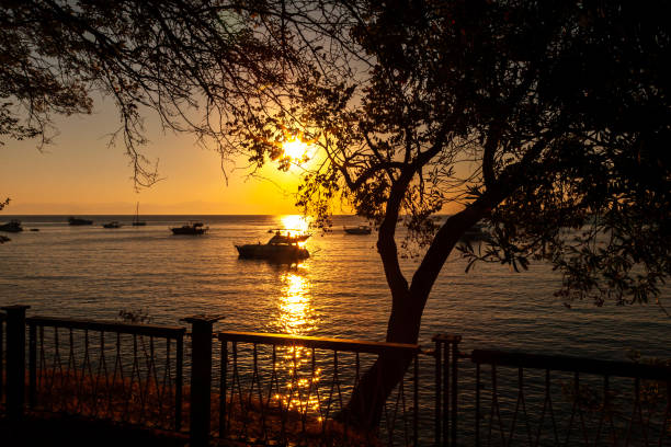 Excursion boats on the shore at sunset. Antalya, Türkiye.