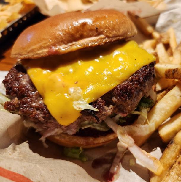 istock Classic American Cheeseburger Closeup Isolated 2168575305