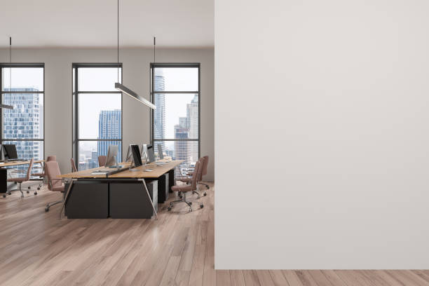 istock Office interior with armchairs and desks, pc computers and window. Mockup wall 2168579579